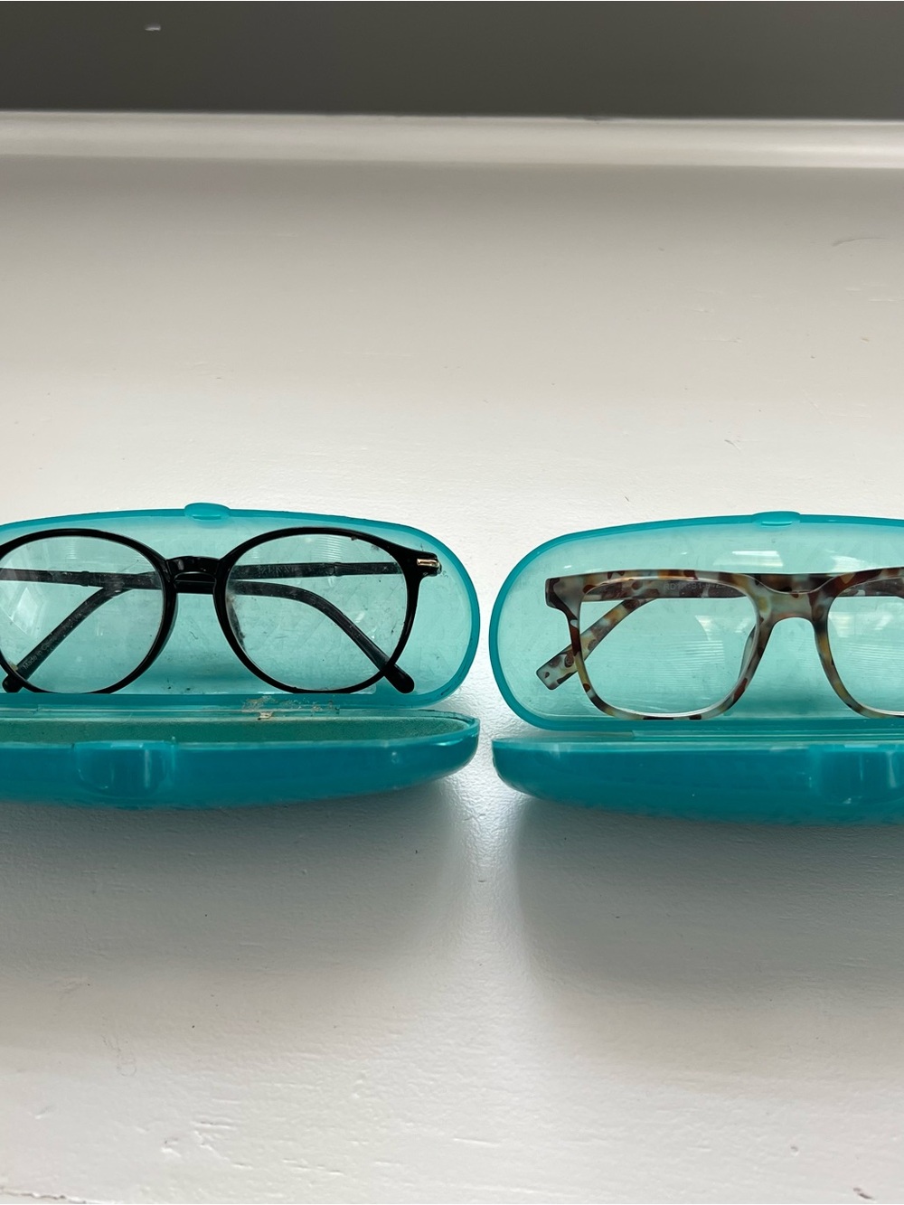 Pair of Everyday Reading Glasses in Black & Tortoiseshell with Teal Cases